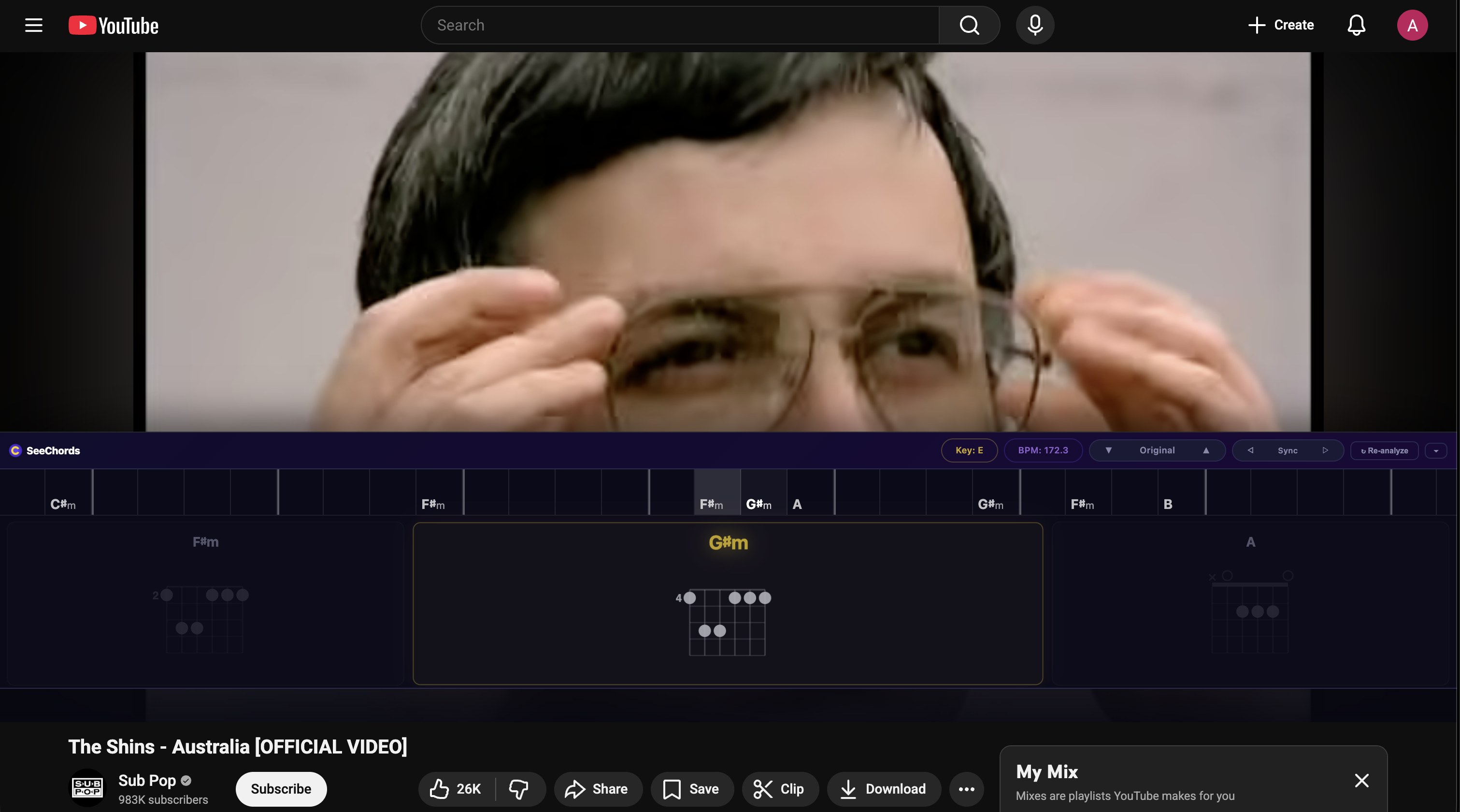 SeeChords extension on YouTube: chord strip with beat blocks, chord diagrams, and controls below the video player.